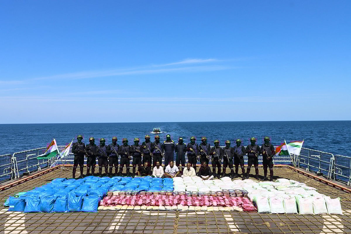 PTI : Indian Navy personnel show 3300Kgs contraband seized from a vessel in a joint operation with Narcotics Control Bureau (NCB). 