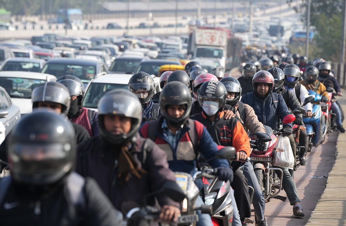 PTI : Vehicles stuck in a traffic jam at NH 24 due to a road closure ahead of farmers protest, in New Delhi, Thursday, Feb, 8