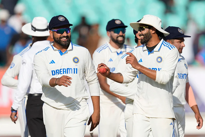 Indias captain Rohit Sharma, left, and teammate Ravindra Jadeja celebrate after India won the third cricket test match against England in Rajkot, India, Sunday, Feb. 18, 2024.