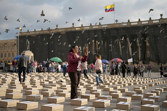 Mourners Stand Among Symbolic Coffins In Bogota, Colombia, Honoring Slain Guerrillas And Social Leaders Since 2016 Peace Agreement