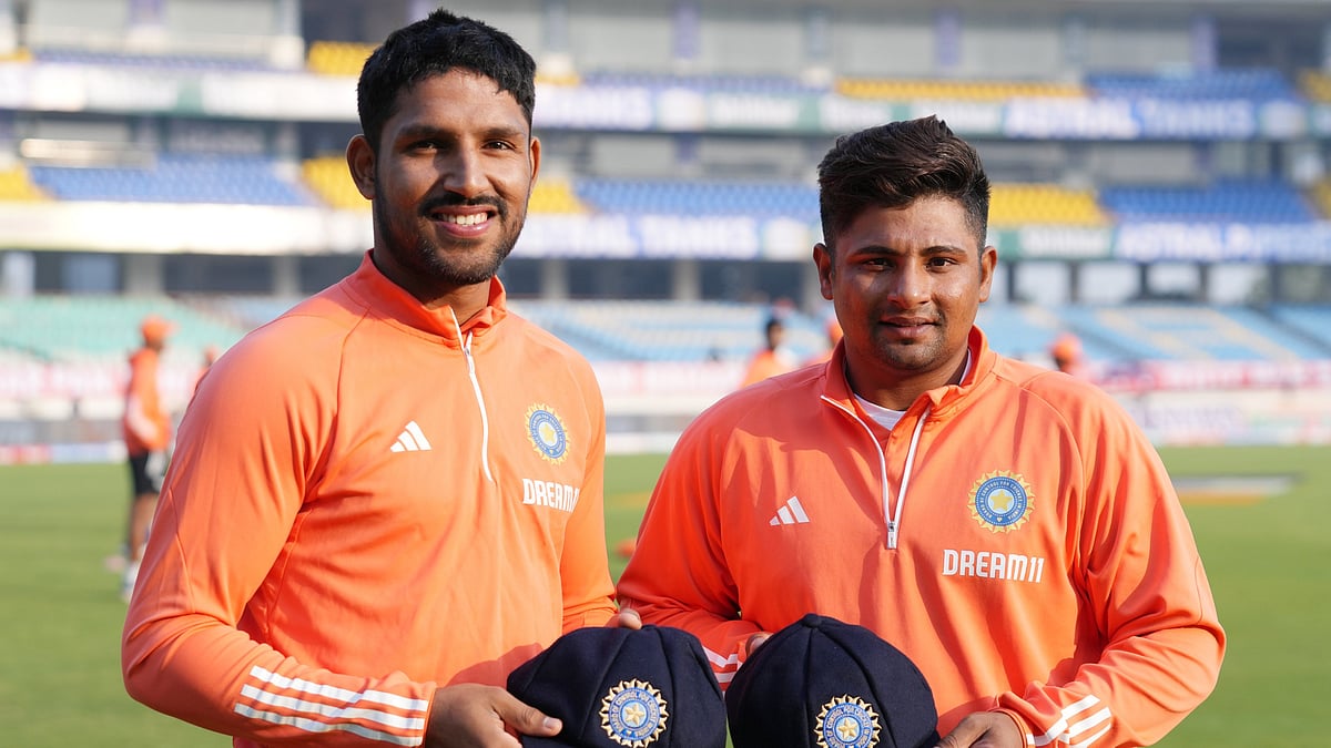 Dhruv Jurel (left) and Sarfaraz Khan posing with the Indian caps. - X/BCCI