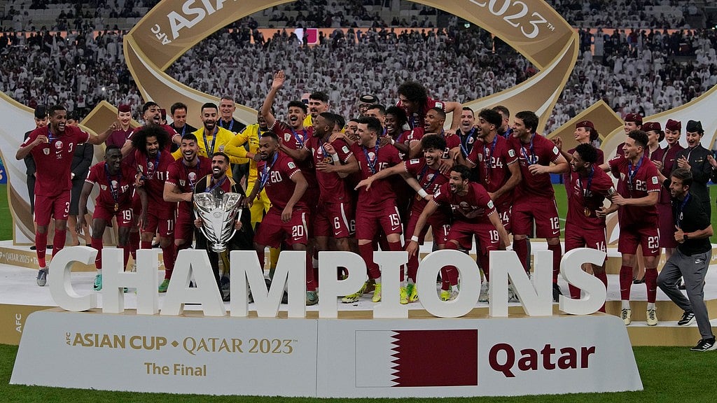 AP : Qatar players pose with the winning trophy at the end of the Asian Cup final match against Jordan at the Lusail Stadium in Lusail, Qatar on February 10, 2024.