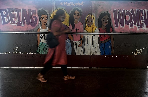 Getty Images : A woman walks past a mural highlighting womens empowerment in Mumbai (Representative image)