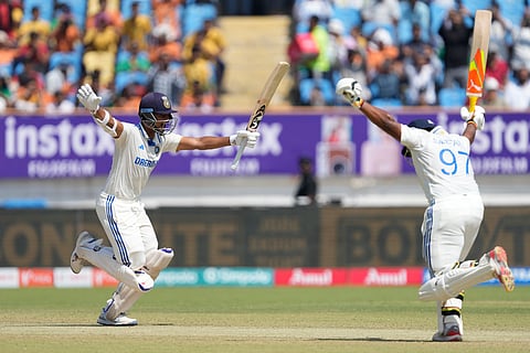 Sarfaraz Khan (right) joins his teammate Yashasvi Jaiswal in celebrating the latter's double century on the fourth day of the third Test match between England and India in Rajkot.