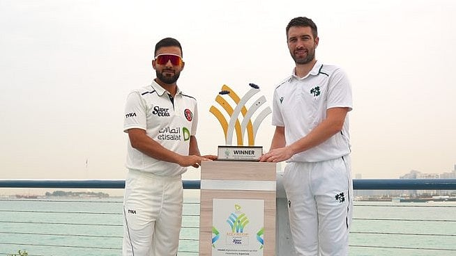 Photo: X/ @ACBofficials : Afghanistan captain Hashmatullah Shahidi and Ireland skipper Andrew Balbirnie posing with the one-off Test match trophy.