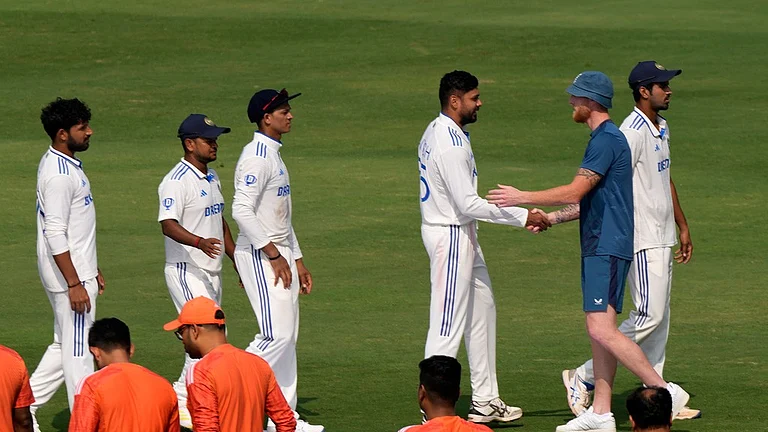 England's captain Ben Stokes congratulates India's captain Rohit Sharma after the end of the 2nd Test match in Visakhapatnam on February 5, 2024. - AP