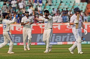 AP Photo/Manish Swarup : Jasprit Bumrah, center, celebrates the wicket of England's wicketkeeper Jonathan Bairstow, right, on the second day of the second cricket test match between India and England in Visakhapatnam.