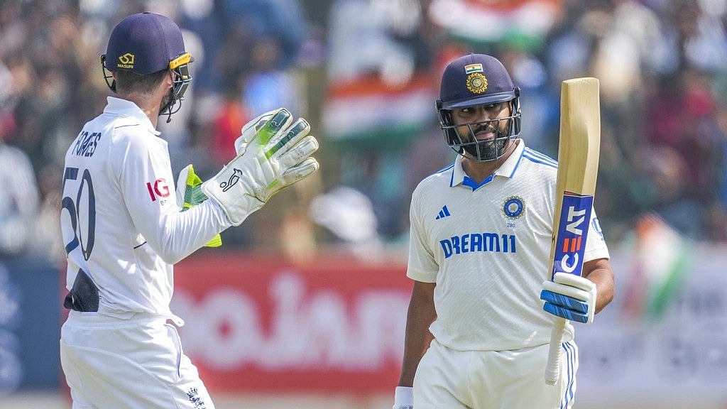 Rohit Sharma celebrates his half-century - AP/ Ajit Solanki)