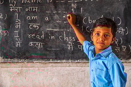 Representative image/Getty Images : Indian schoolboy in classroom |