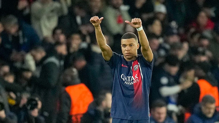 PSG's Kylian Mbappe celebrates after scoring his side's opening goal during the Champions League round of 16 first-leg soccer match between Paris Saint-Germain and Real Sociedad, at the Parc des Princes stadium in Paris, France, Wednesday, Feb. 14, 2024.
 - (AP Photo/Christophe Ena)