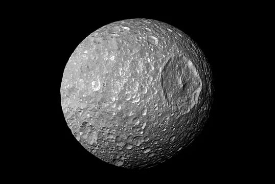Saturn's 'Death Star' Moon Is Hiding A Young Vast Ocean Under Its Icy Crust, Scientists Say