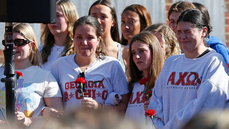 Alpha Chi Omega sorority members mourn the loss of their sorority sister, Laken Riley. - AP