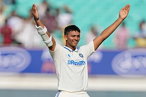 AP/Ajit Solanki : India opener Yashasvi Jaiswal celebrates his century against England on Day 3 of the third Test in Rajkot.