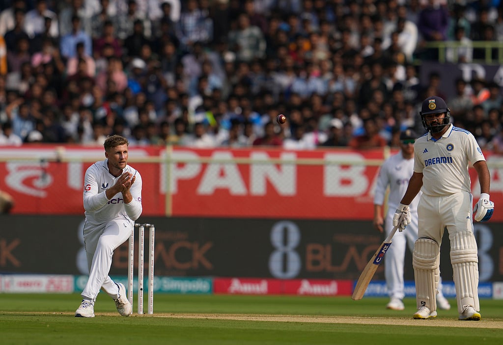 AP Photo/Manish Swarup : Indian captain Rohit Sharma (R) and England's Joe Root in action on Day 1 of 2nd Test in Visakhapatnam
