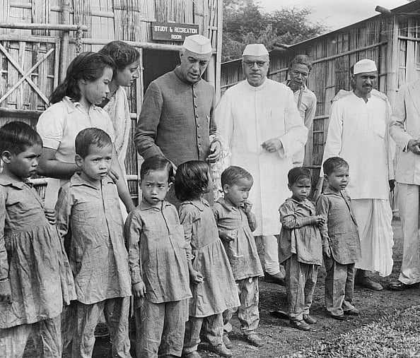 Getty Images : 27th Oct 1952: Jawaharlal Nehru visits children at the leper colony at Pasighat, Assam, with Jairamdas Daulatram.