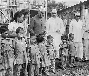 Getty Images : 27th Oct 1952: Jawaharlal Nehru visits children at the leper colony at Pasighat, Assam, with Jairamdas Daulatram.