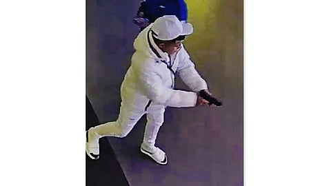 This surveillance image taken from a wanted poster provided by New York City Police Department Deputy Commissioner of Operations Kaz Daughtry on Friday, Feb. 9, 2024, shows a suspected shoplifter who shot a tourist in the leg inside a Times Square, New York, sporting goods store on Thursday, Feb. 8, 2024, who then fled into the street, stopping to shoot at a pursuing police officer.