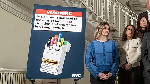 A warning poster against social media present during the announcement by NYC Mayor.