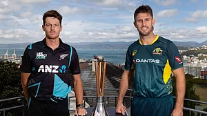X/BLACKCAPS : Kiwi skipper Mitchell Santner (left) posing with the T20I trophy alongside his Aussie counterpart Mitchell Marsh.
