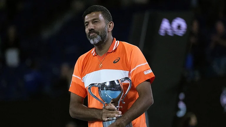 Rohan Bopanna of India holds his trophy after he and partner Matthew Ebden of Australia defeated Simone Bolelli and Andrea Vavassori of Italy in the men's doubles final at the Australian Open 2024 at Melbourne Park, Melbourne on January 27, 2024. - (Photo: AP)