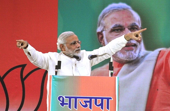 Getty Images : The-then Gujarat CM Narendra Modi during the BJP Janjaati Morcha Sammelan rally at Maharana Bhupal Stadium in 2013.
