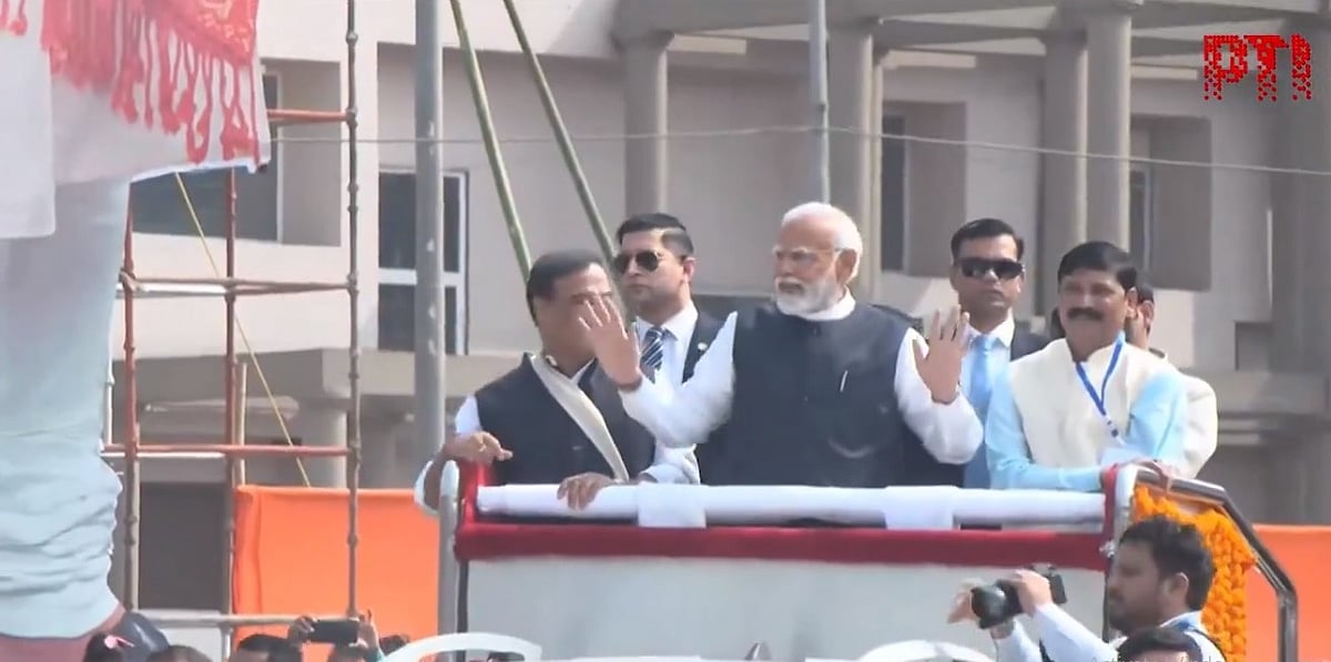 PTI : Prime Minister Narendra Modi during roadshow in Assam.