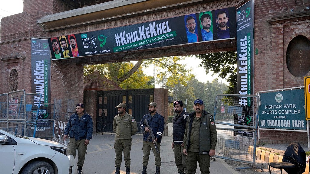Police stand guard at an entry gate of the Gaddafi Stadium, Lahore ahead of the Pakistan Super League on February 14, 2024. - AP