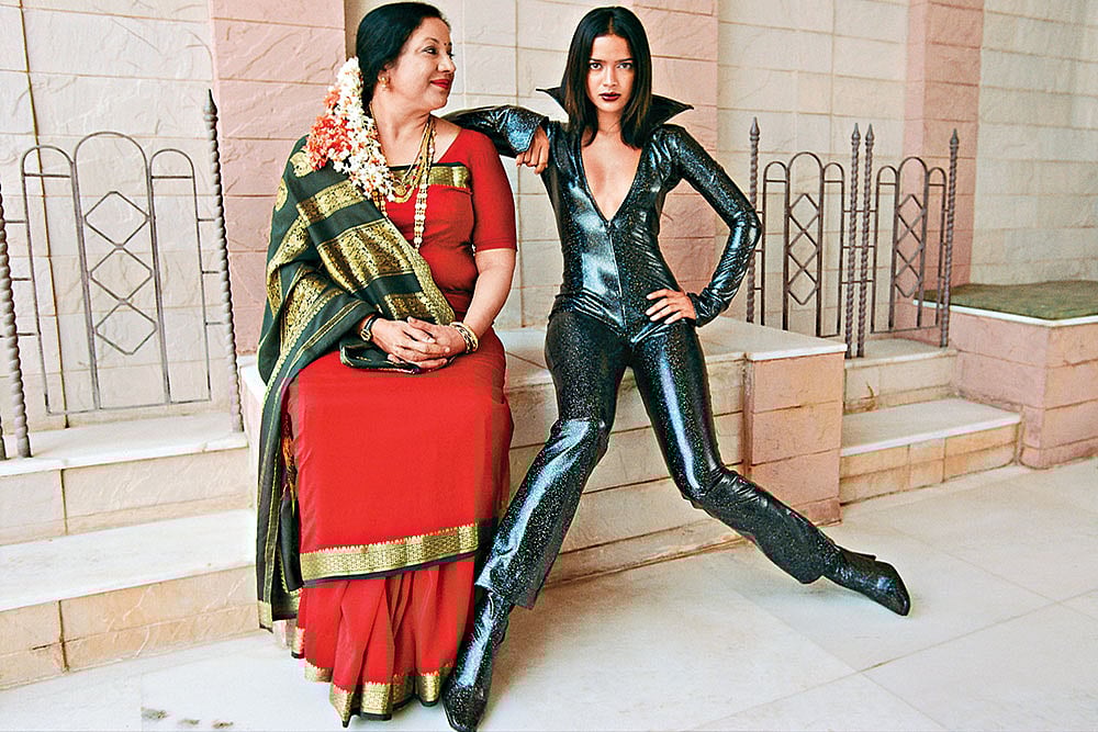 Photo: Getty Images : The Contrast: An Indian mother poses with her model daughter.