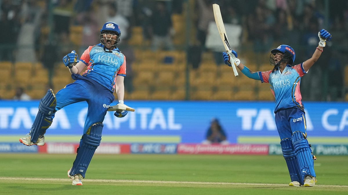 Photo: PTI : Sajeevan Sajana (left) exults after hitting the last-ball six that won the match for Mumbai Indians, against Delhi Capitals in the Women's Premier League 2024 in Bengaluru.