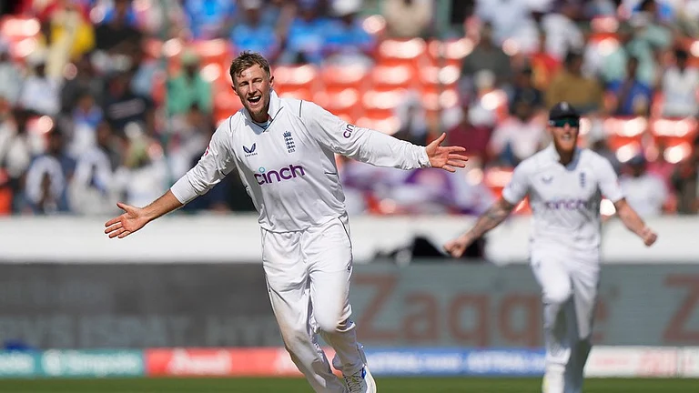 England's Joe Root, front, celebrating the wicket of India's KL Rahul on the fourth day of the first cricket test match between England and India in Hyderabad, India, Sunday, Jan. 28, 2024. - (AP Photo/Mahesh Kumar A.)