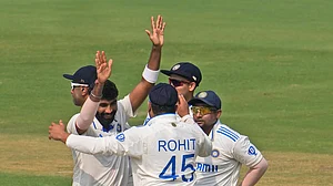 AP Photo/Manish Swarup : Jasprit Bumrah, left, celebrates after he took the last wicket for India to win the second Test match against England in Visakhapatnam.