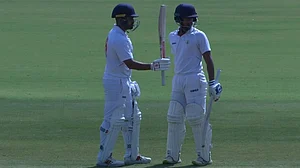 Photo Courtesy: X/ @BCCIdomestic : Vidarbha's Karun Nair after scoring fifty on Day 2 of the Ranji Trophy 2023-24 quarterfinal match against Karnataka.