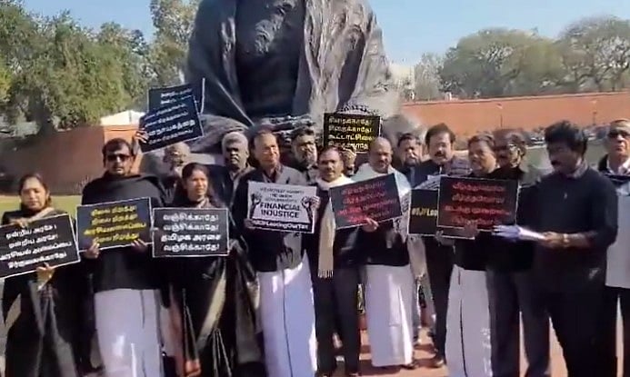 Screen grab from video posted on X/ANI : DMK MPs in Parliament protest against Central government over 'financial injustice' with Tamil Nadu
