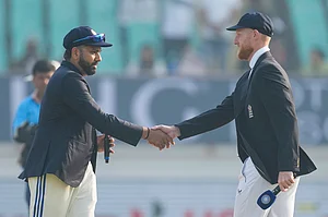 AP : India's captain Rohit Sharma, left, and England's captain Ben Stokes at the toss ahead of the third Test in Rajkot on February 15, 2024.