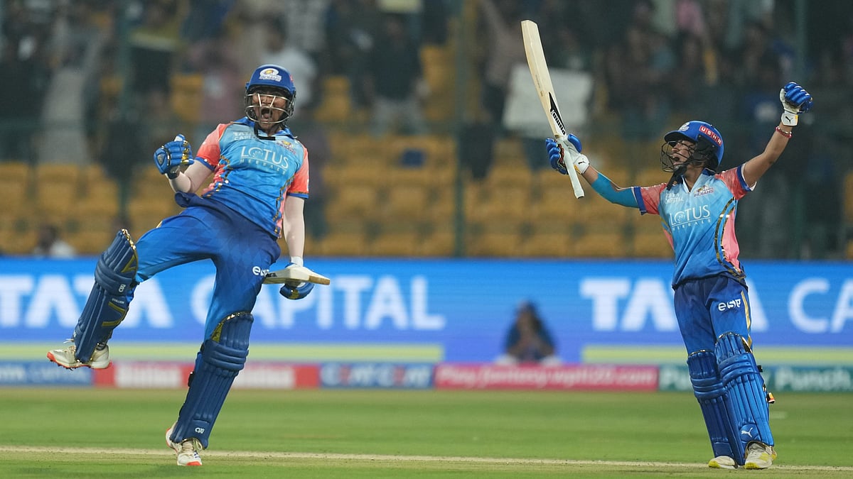 PTI : Sajeevan Sajana (left) exults after hitting the last-ball six that won the match for Mumbai Indians, against Delhi Capitals in the Women's Premier League 2024 in Bengaluru.