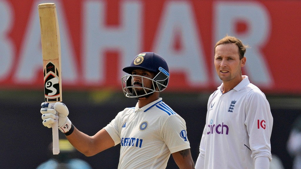 Dhruv Jurel (left) raises his bat after bringing up his fifty. - AP/Ajit Solanki