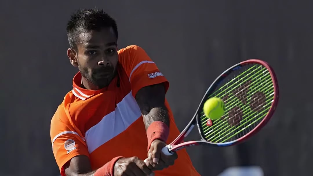 Photo: AP : File photo of India's top-ranked singles tennis player Sumit Nagal in action at Australian Open 2024.