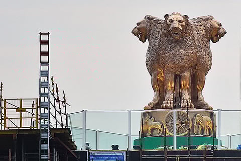 The National Emblem atop the new Parliament