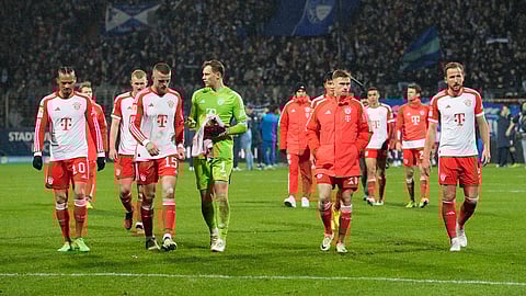 Bayern Munich players leave the pitch after losing their German Bundesliga match against VfL Bochum in Bochum on February 18, 2024.