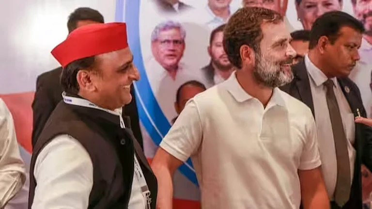 SP chief Akhilesh Yadav with Congress leader Rahul Gandhi. | - PTI