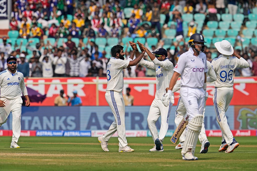 AP Photo/Manish Swarup : Jasprit Bumrah , second left, celebrates the wicket of England's Joe Root on the second day of the second cricket Test match between India and England in Visakhapatnam.