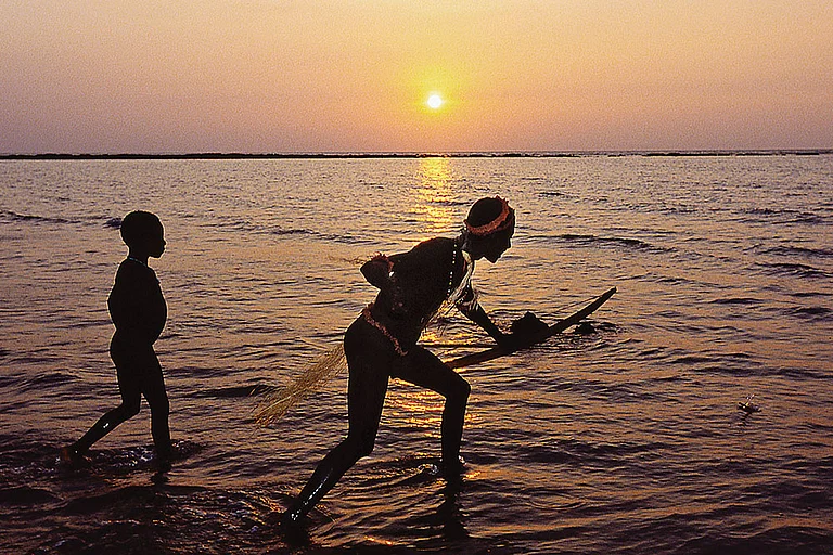 In Isolation: Jarawas fishing
on a coral reef - Photo: Getty Images