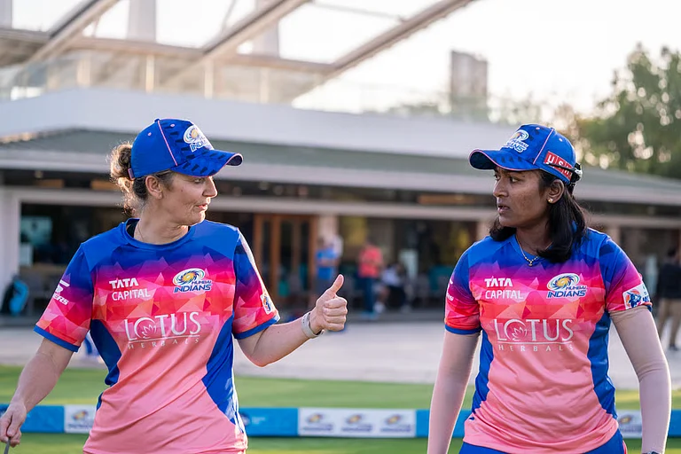 Mumbai Indians head coach Charlotte Edwards in conversation with all-rounder Sajana Sajeevan, who was picked at the WPL 2024 auction. - Mumbai Indians