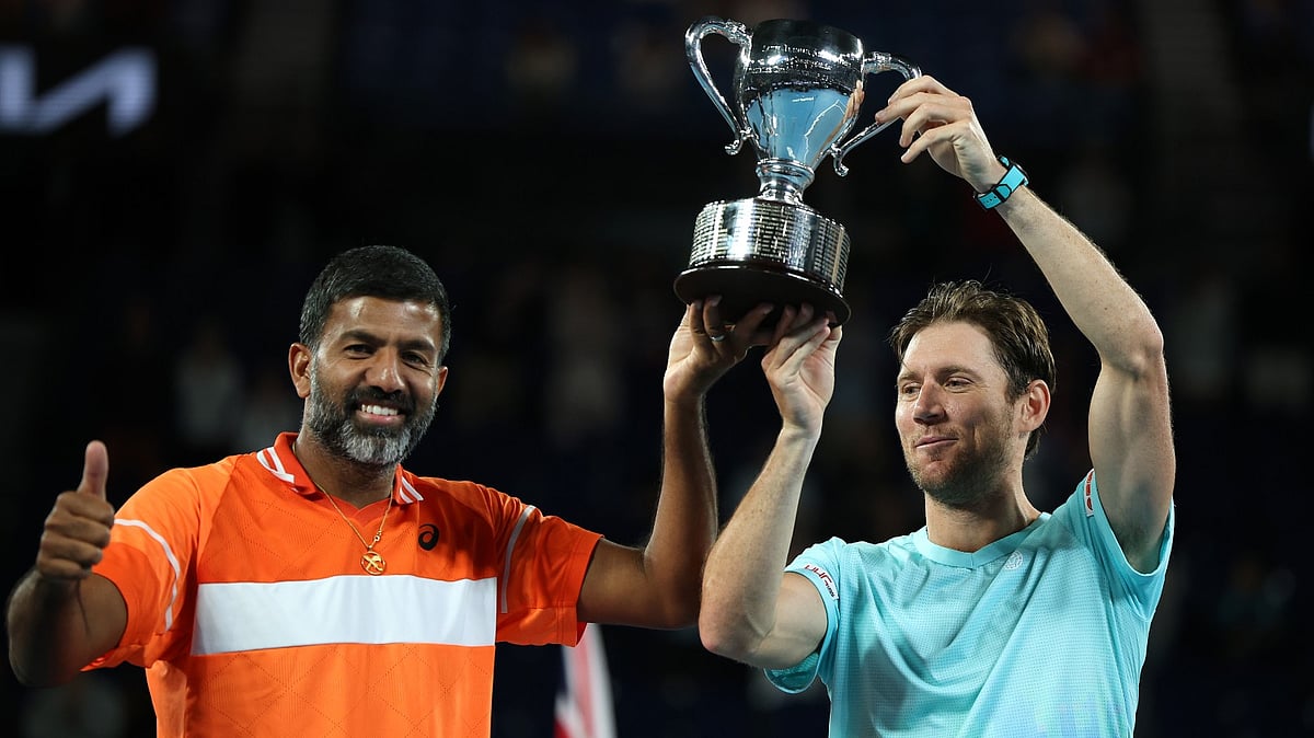 X/ @BBCWSSport : Rohan Bopanna (L) along with his partner Matthew Ebden posing with the Australian Open 2024 trophy.