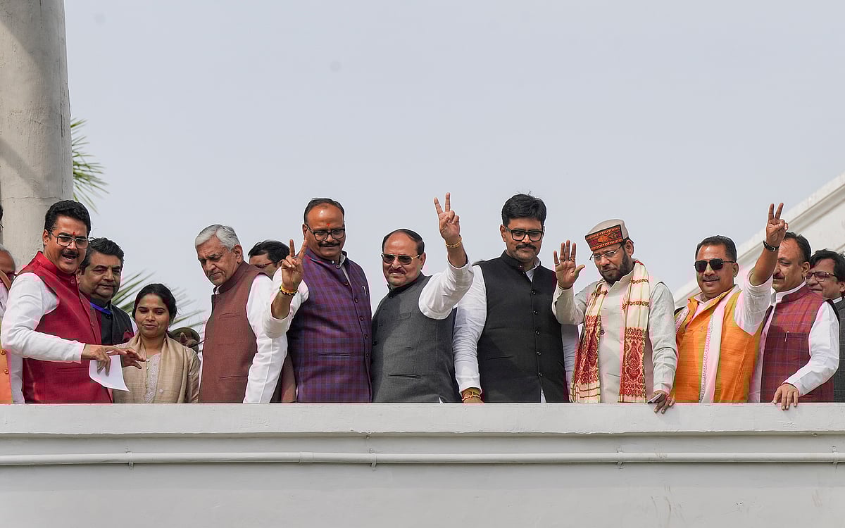 PTI : Samajwadi Party MLAs showing victory sign after casting their vote in Lucknow.
