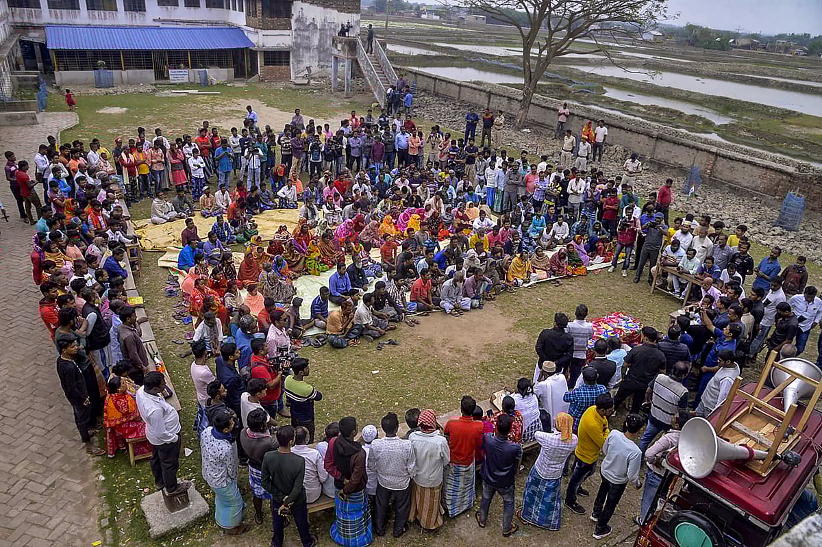 PTI : North 24 Parganas: TMC leaders Sujit Bose and Partha Bhowmick interact with villagers during their visit to Sandeshkhali, in North 24 Parganas district, Sunday, Feb. 25, 2024. 