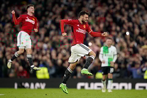 Bruno Fernandes, centre, celebrates after Manchester United won the FA Cup quarter-final match against Liverpool at the Old Trafford stadium in Manchester.