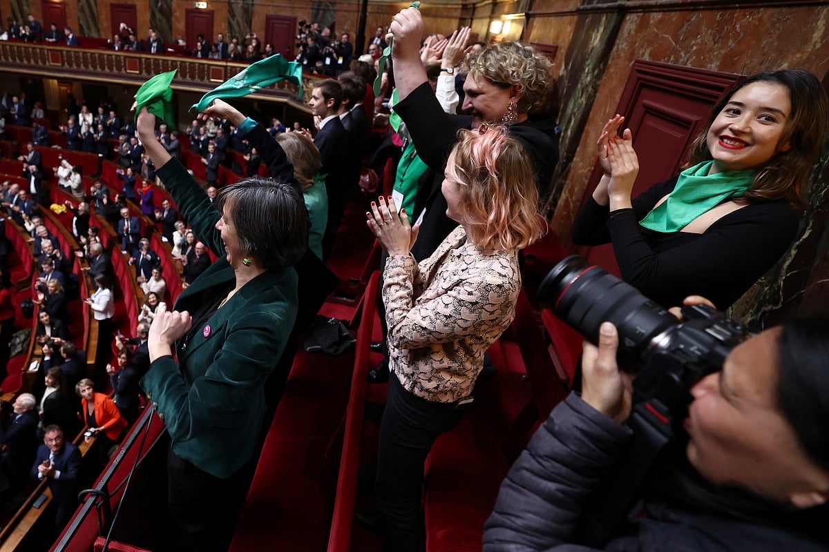 AP : French lawmakers celebrate after they approved a bill that will enshrine a woman’s right to an abortion in France's constitution, at the Palace of Versailles, Monday, March 4, 2024 in Versailles, west of Paris