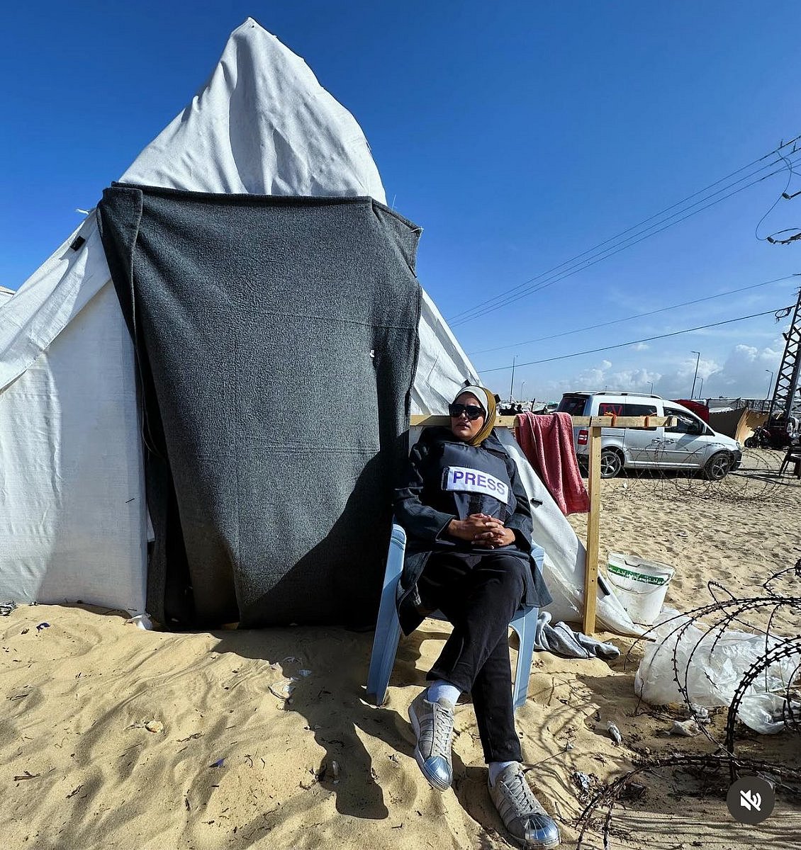 Credit: Haneen Harara on Twitter : Palestinian journalist Haneen Harara sits outside a makeshift tent in the southern Gazan city of Rafah 
