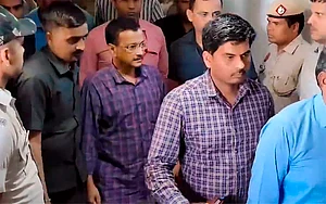 PTI : New Delhi: Delhi Chief Minister Arvind Kejriwal being produced before the Rouse Avenue Court, in New Delhi, Friday, March 22
